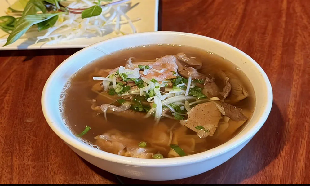 Vietnamese beef pho with herbs and bean sprouts at Pho Thi, a Vietnamese Restaurant in Oregon City