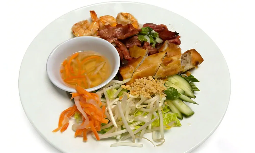 Vietnamese grilled meat and shrimp platter with dipping sauce at Pho Thi, a Vietnamese Restaurant in Oregon City