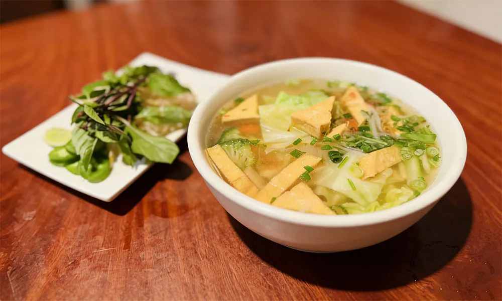Vegan tofu vegetable soup with fresh herbs at Pho Thi, a Vietnamese Restaurant in Oregon City